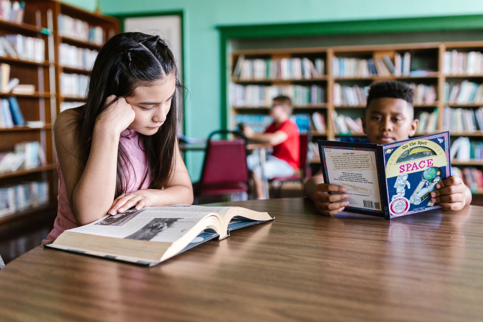 A-level students reading around a subject in the Brightmind library corner