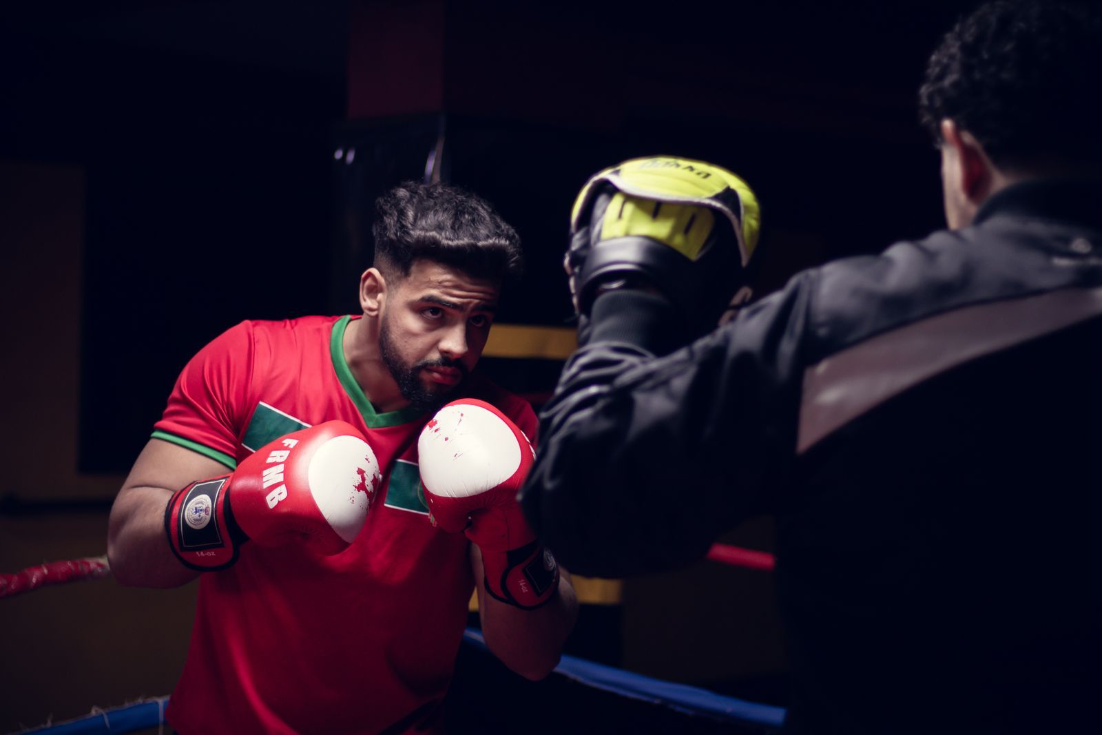 A member working the heavy bags in the Pulse bag room