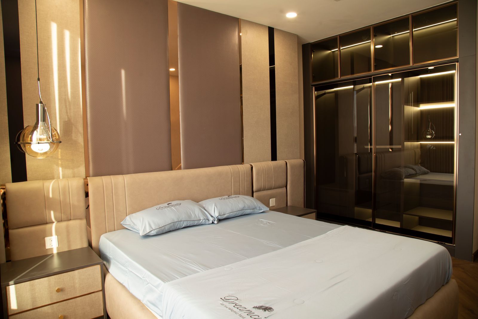 A classic king room at The Meridian with walnut furniture and a sash window over the gardens