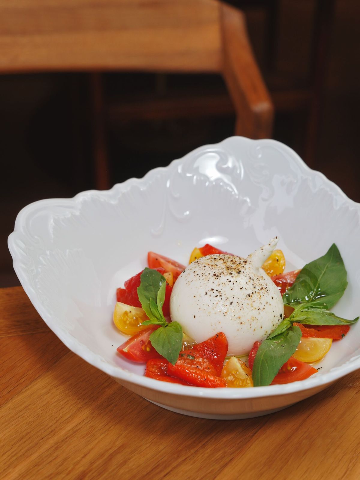 Burrata with charred peach and basil oil