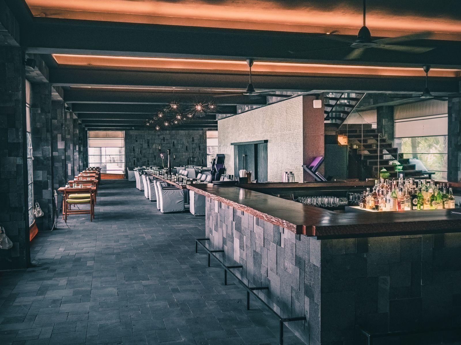 The main dining room at Oliva, tables laid for the evening service