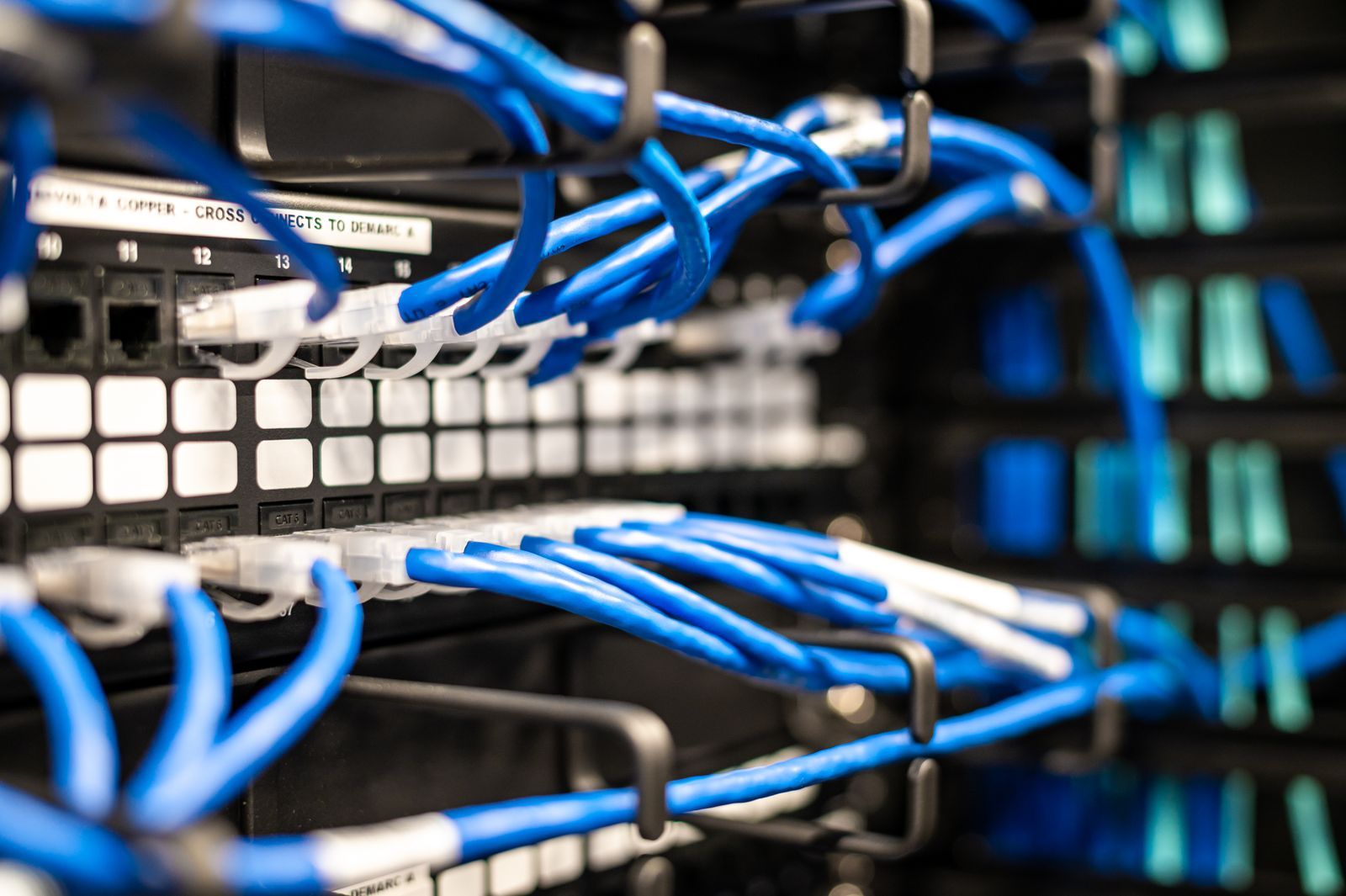 Patch cables terminated into a managed network switch by a Nexis engineer